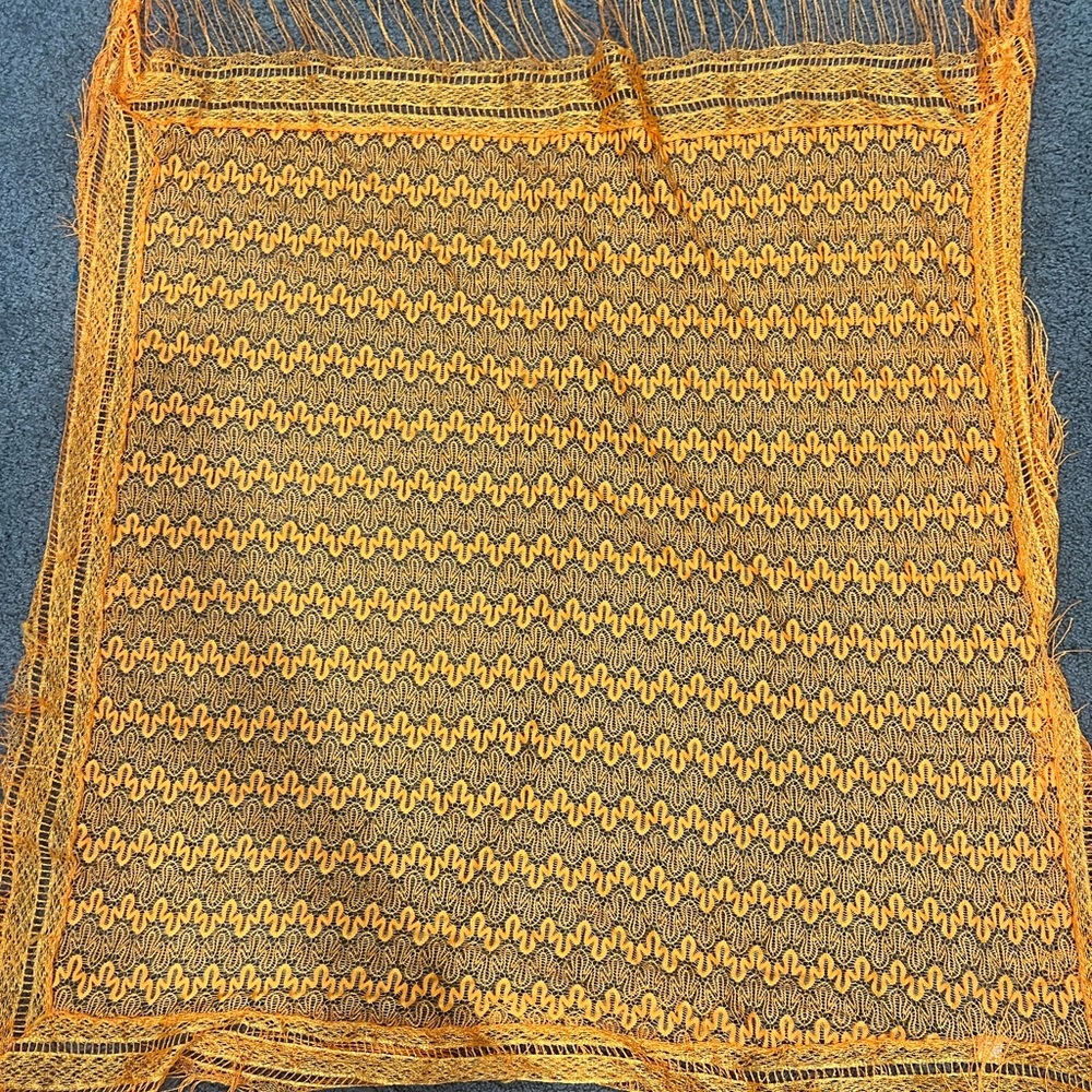Woman’s orange wrap